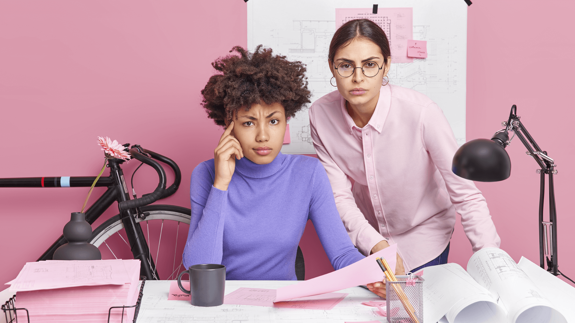 two women working and thinking 1